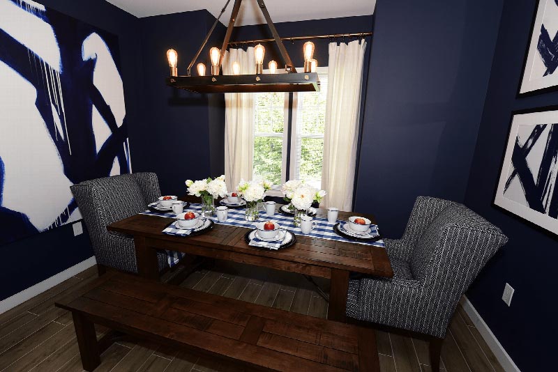 Hawthorne Square Dining Area showing the dining room with a long table and two chairs and two benches. There are decorations on the table and pictures on the wall.