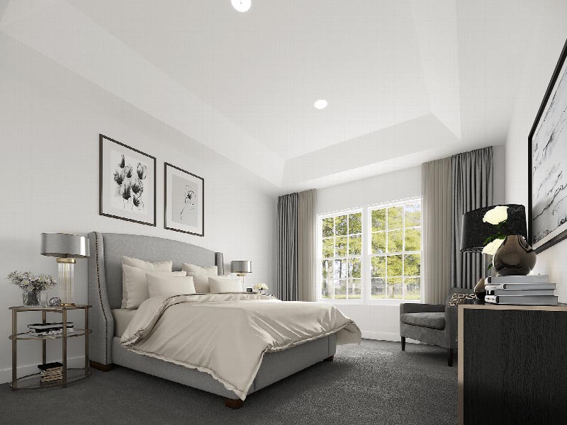 Suites at Sun Valley rendering of a Master Bedroom showing a queen sized bed with an end table and a large dresser. There is a sitting chairs and various wall decorations. Plush wall to wall carpeting covers the floors, and a large window allows for natural light.