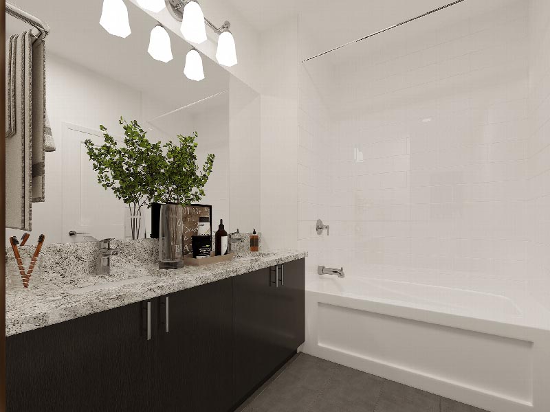 Suites at Sun Valley rendering of a bathroom showing a tub, and large vanity with mirror.