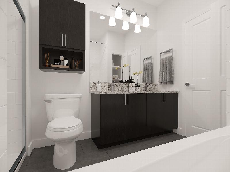 Suites at Sun Valley rendering of a bathroom showing a toilet with medicine cabinet above, a vanity with sink and a mirror above.