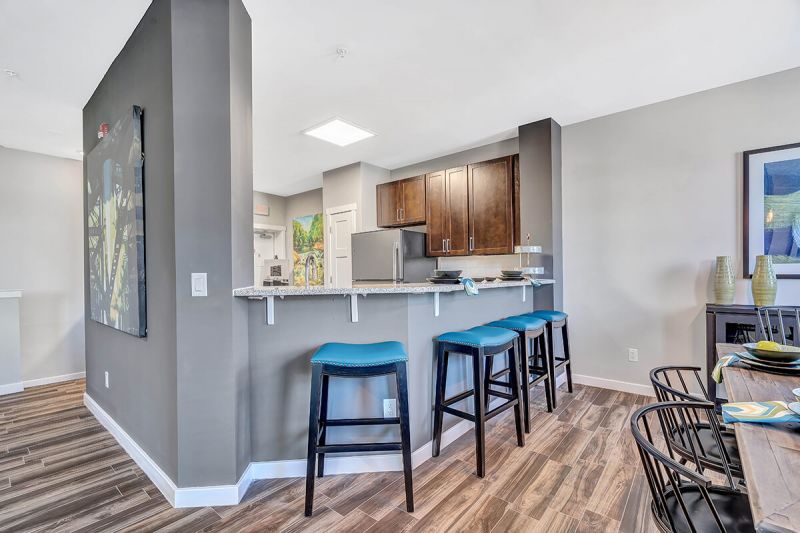 River Links interior photo showing the breakfast bar, with stools under the countertop from the kitchen.
