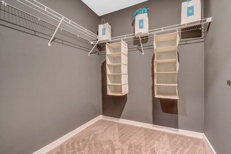 River Links interior photo of the primary bedroom showing the large walk in closet