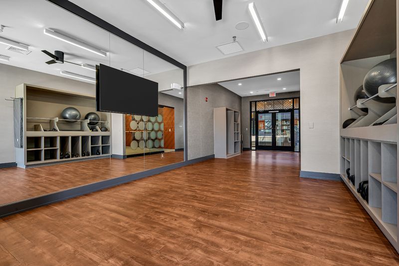 Interior photo of the movement studio inside the clubhouse at Ewing Town Center for yoga and stretching.