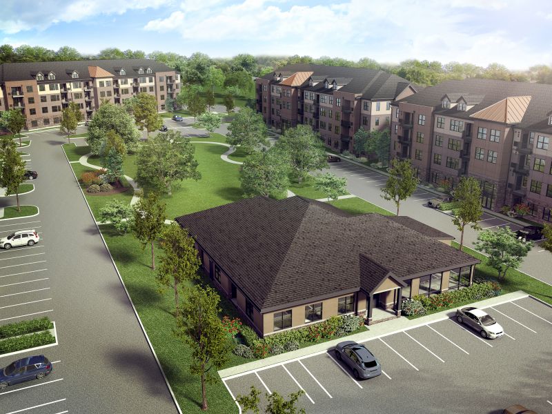 Grove Crossing Leasing Center & Clubhouse aerial photo showing the Clubhouse and apartment buildings. There are several bushes and trees highlighting the landscape.