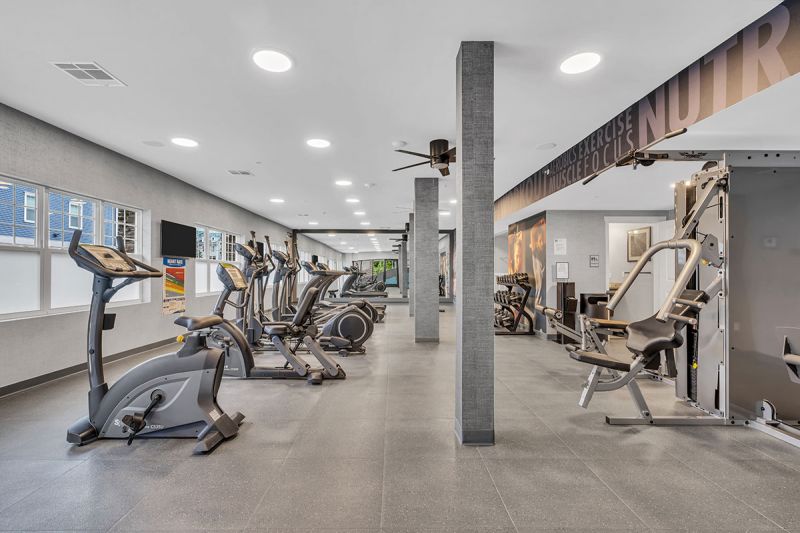 Interior photo of the community gym at Amwell Terrace showing various pieces of cardio equipment, free weights and a strength training machine