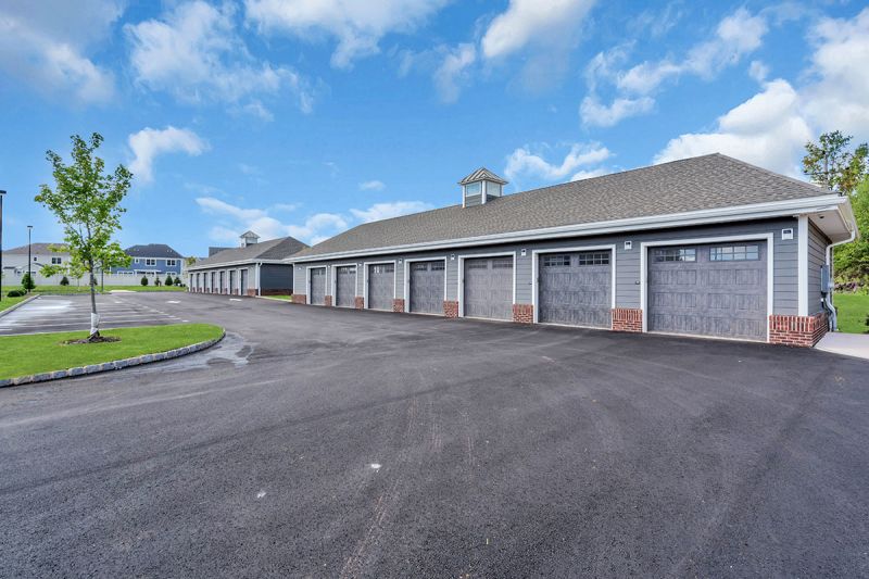 Exterior photo of Meadows at Montgomery showing the optional garages available for an additional fee.