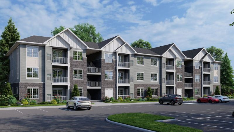 Artists rendering of the exterior of a typical apartment building at Rivendell Meadows in Piscataway. This 3-story building shows a facade finished with siding, and stone. A lush green lawn and sidewalks are shown in the foreground.