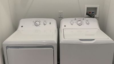 Rivendell Meadows Affordable interior photo showing a full size, side by side, washer and dryer
