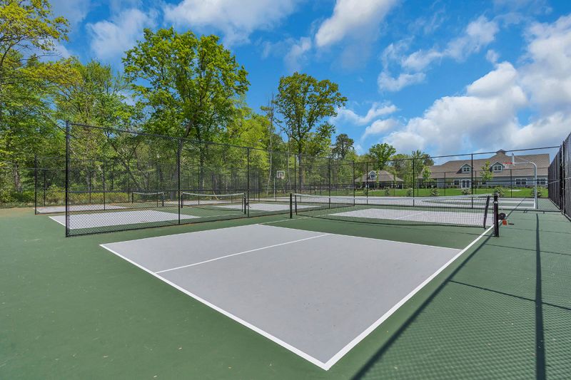 Exterior photo of the 3 outdoor pickleball courts outside of the clubhouse at Woodhaven.