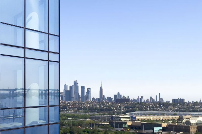 Exterior photo showing the view from the 19th Floor Club balcony, featuring fantastic views of the New York City skyline.