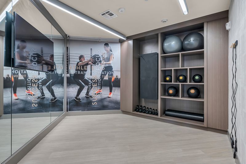 Interior photo of the gym at the Enclave at Woodhaven showing a room dedicated to yoga and stretching exercises.