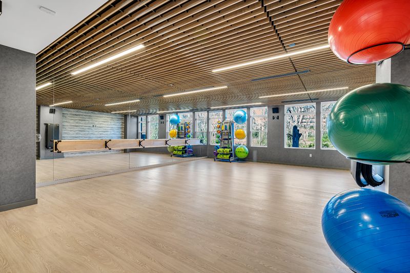 Interior photo of the movement studio at Woodland Square for yoga and stretching