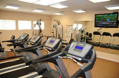 North Brunswick Manor Gym photo showing four treadmills, an exercise bike and various other exercise equipment.