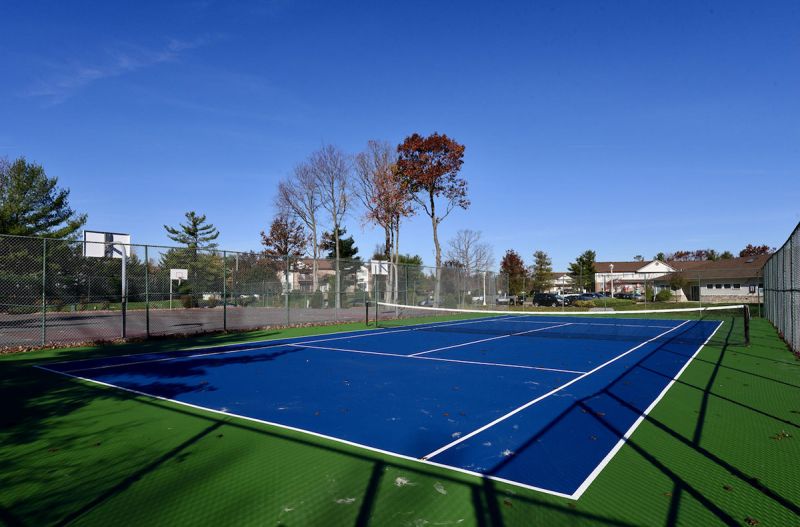 Photo showing the completely redone outdoor tennis court at North Brunswick Manor.