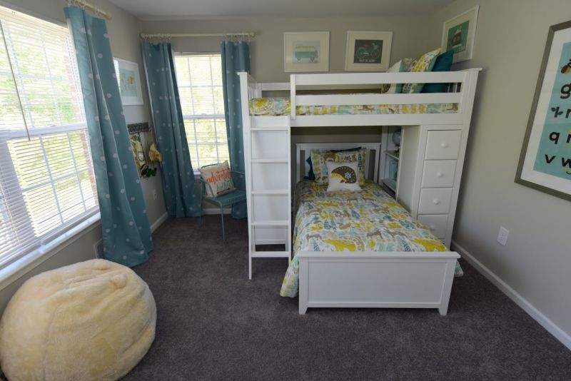 Maebrook at Renaissance interior photo of a childrens bedroom showing bunk beds, several windows and wall to wall carpeting.