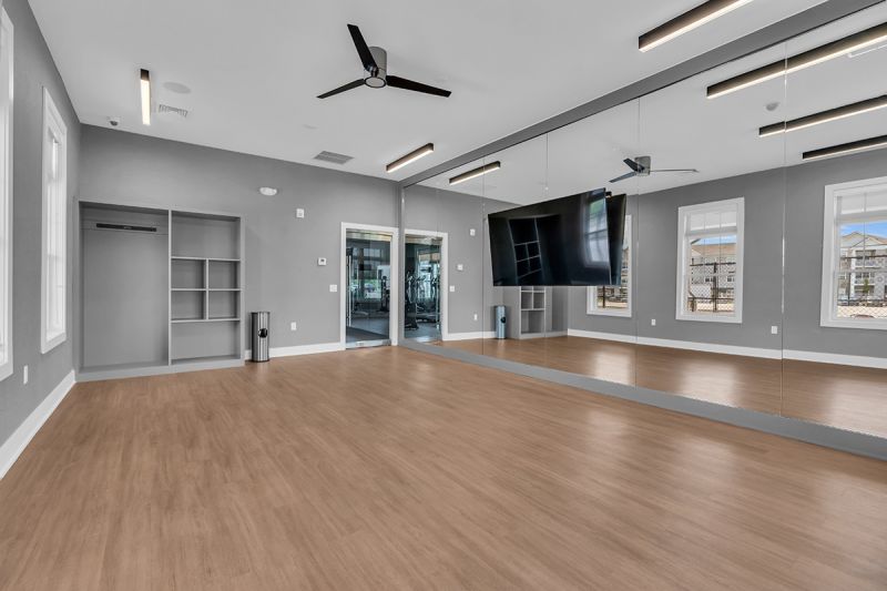 Interior image of the Rivendell Club House showing a dedicated room for using stationary bikes.