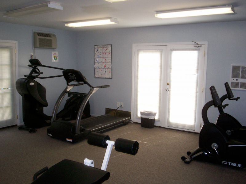 Woodbridge Center Plaza image of some of the gym equipment, featuring several pieces of cardio training equipment including a treadmill and several stationary bikes.
