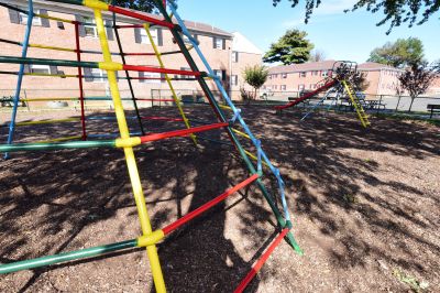 Cloverleaf Gardens photo of playground equipment including a jungle gym and a slide