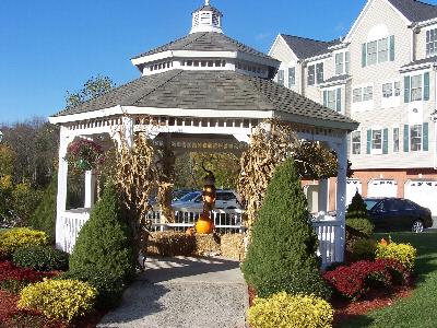 Photo of a gazebo located on the Sun Valley property decorated for the fall with pumpkins, hay and corn stalks.