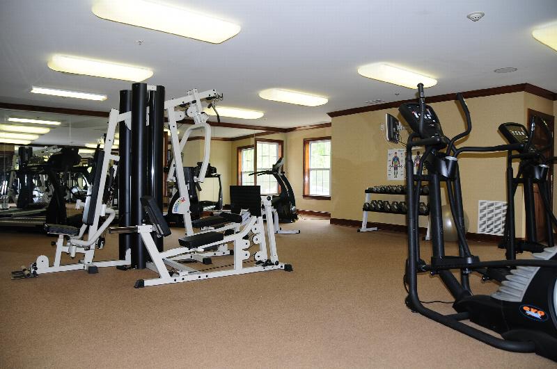 Park Terrace community gym photo showing various pieces of cardio and strength training machines.