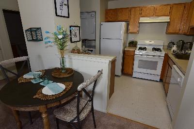 Yorkshire Village gym photo showing an elliptical, two treadmills and two exercise bikes. There are motivational pictures on the wall.