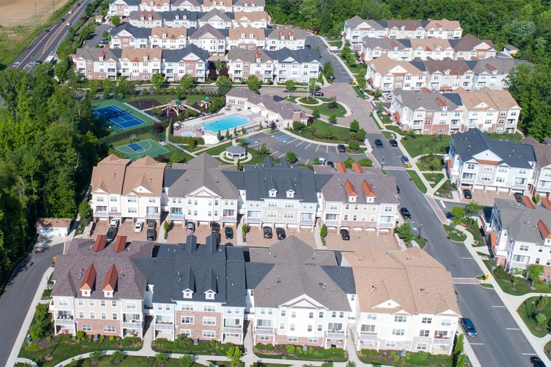 Princeton Terrace site plan photo displaying an aerial view of the property. The swimming pool, playground, tennis court and basketball court can be seen located to next to each other. Several trees highlight the landscape.