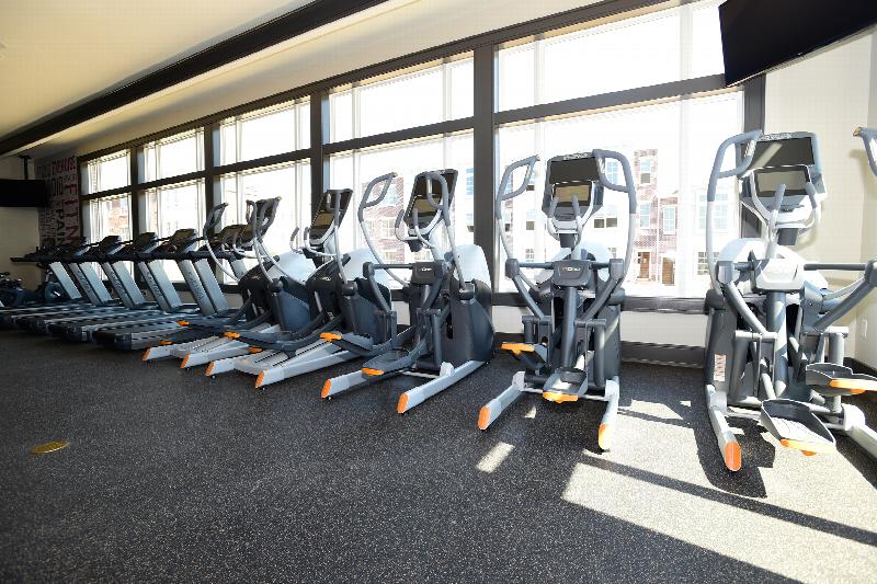 Station Village at Avenel photo of the gym shows multiple treadmills and multiple elliptical cardio machines.