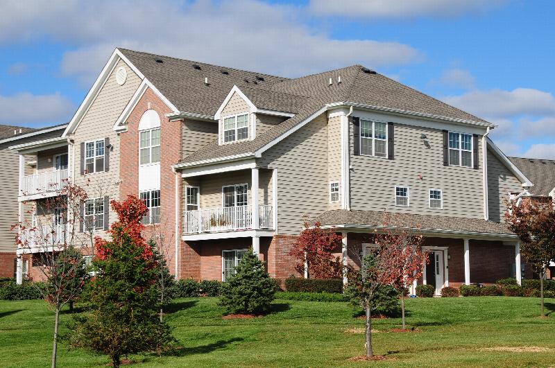 Pike Run Meadows Exterior photo showing several balconies. Several bushes and trees highlight the landscape.