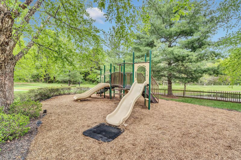 Exterior photo of a playground at Pike Run, showing a piece of playground equipment.